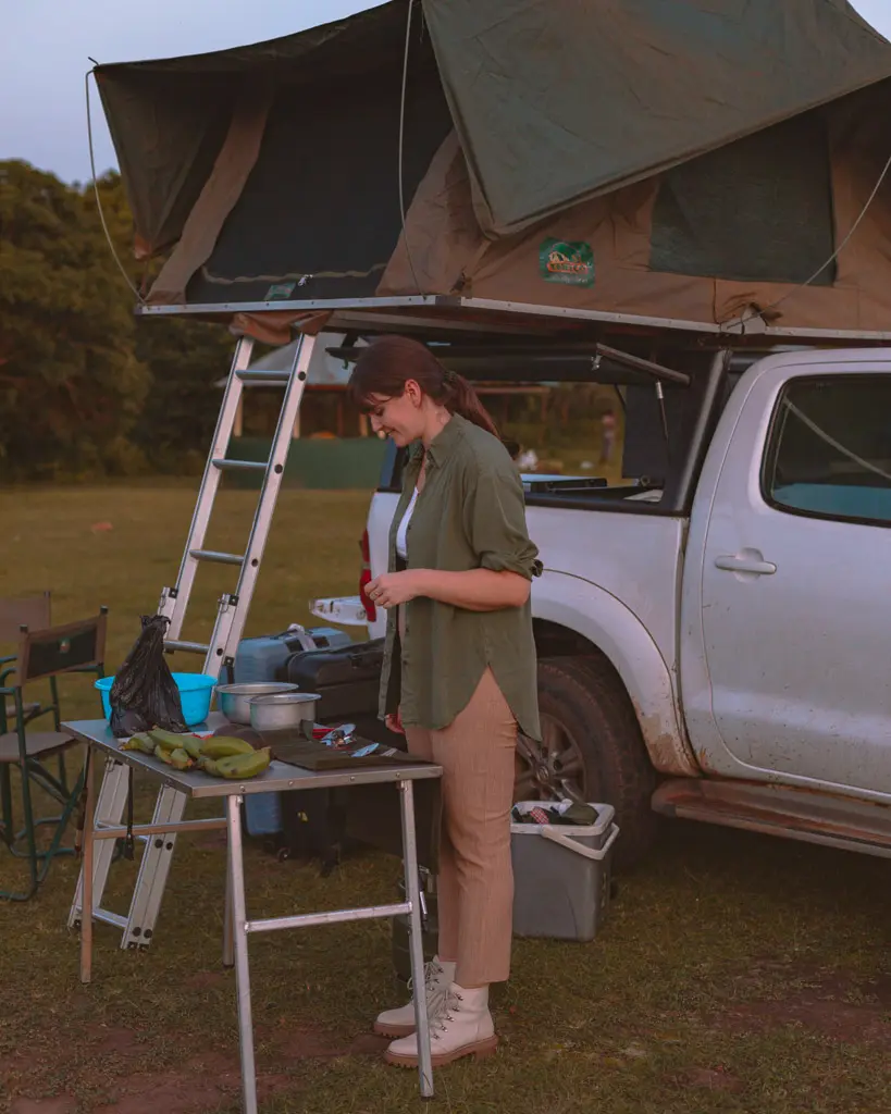 Preparing your food next to your rooftop tent near Lake Mburo